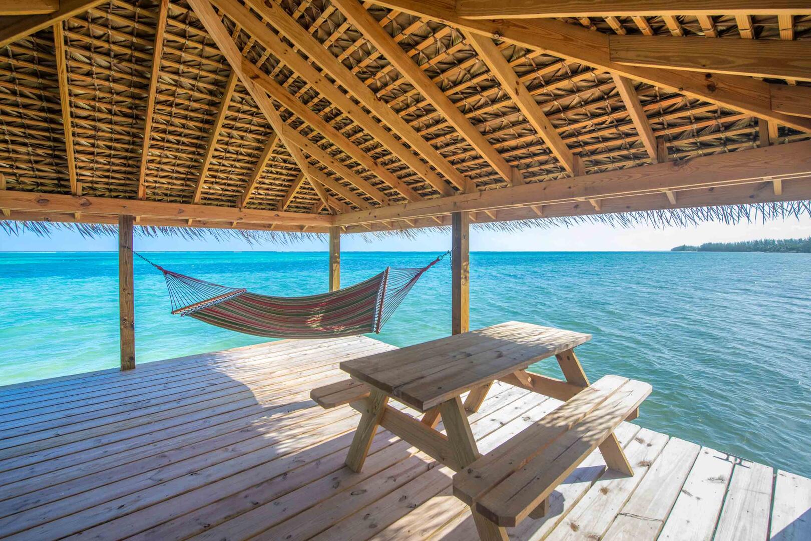 The private dock comes furnished with a picnic table and hammock to lounge above the waves.