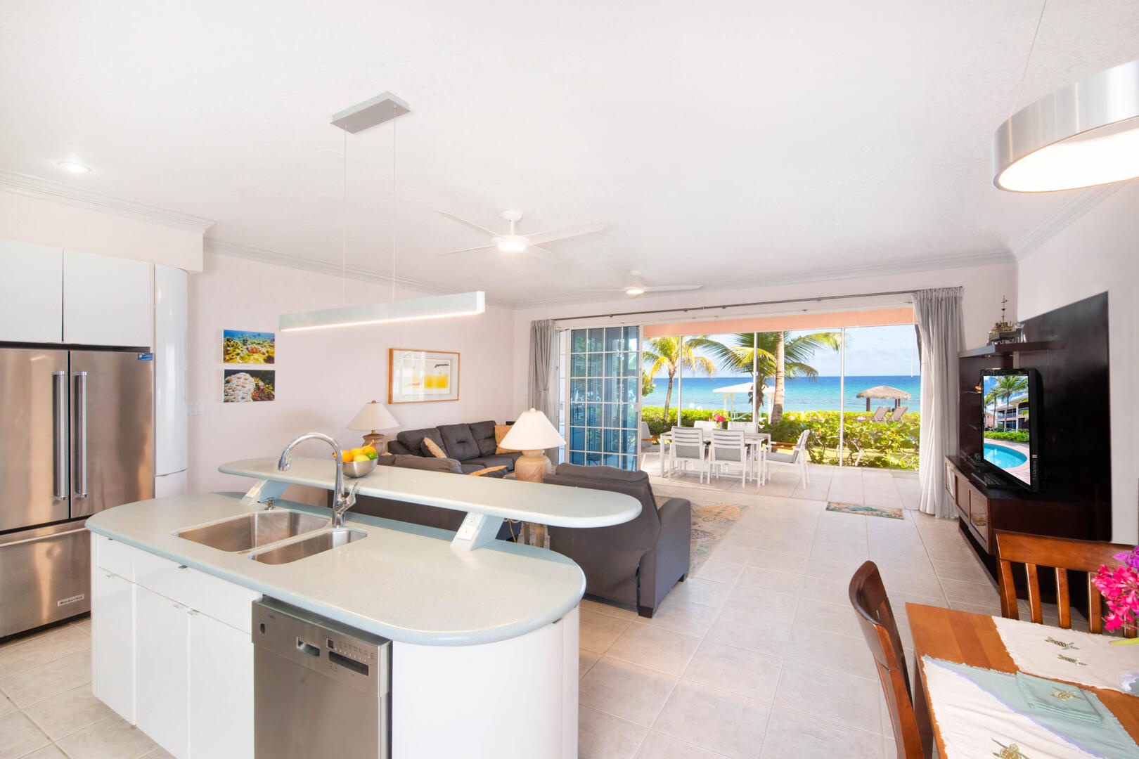 Kitchen view looking out over the living area and screened porch.