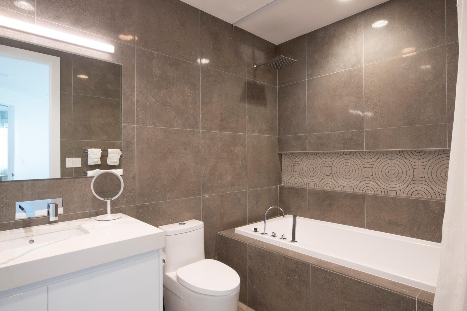 Guest Suite ensuite bath with tub and walk-in shower.