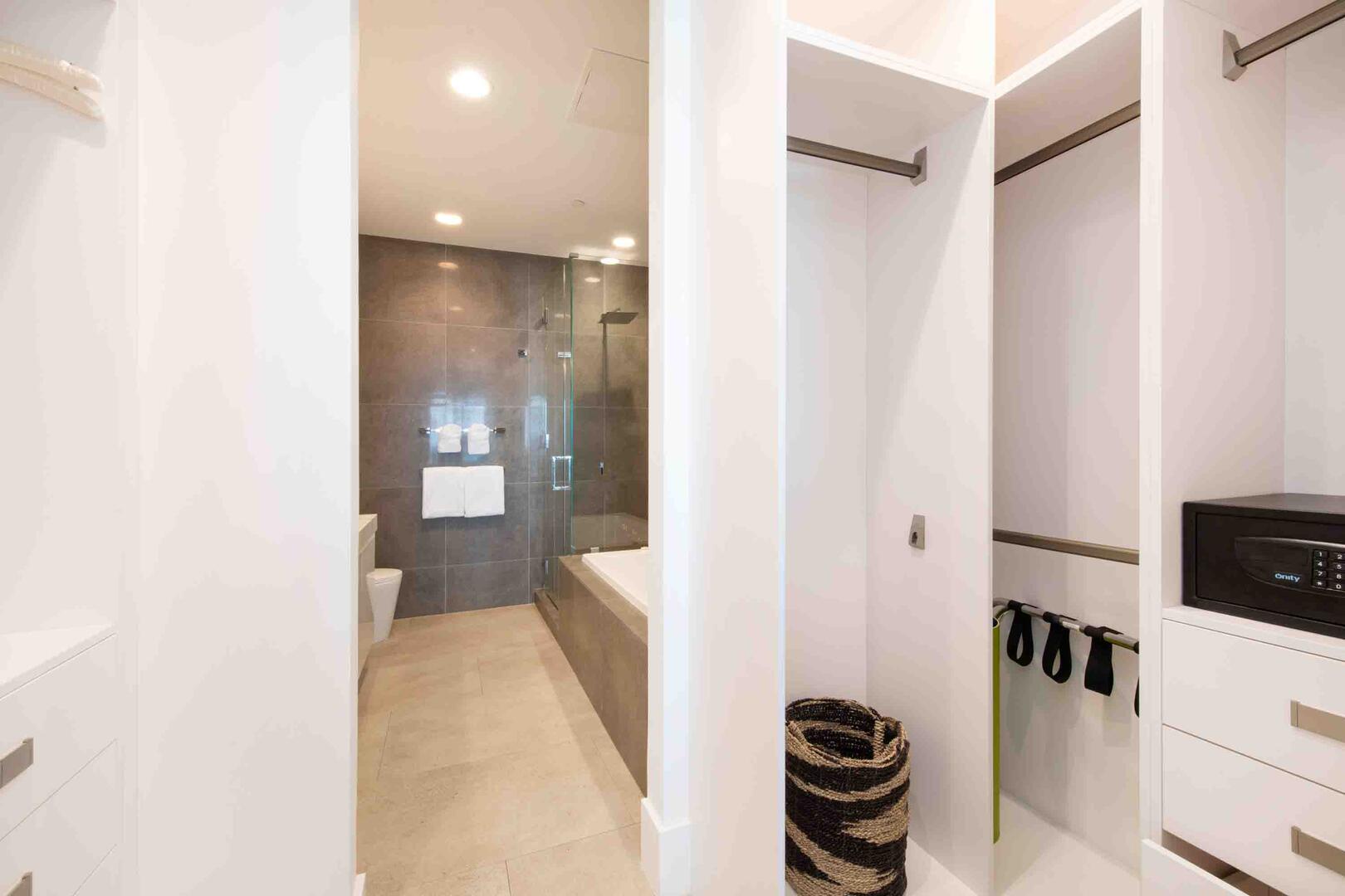Walk-thru closet with room safe.