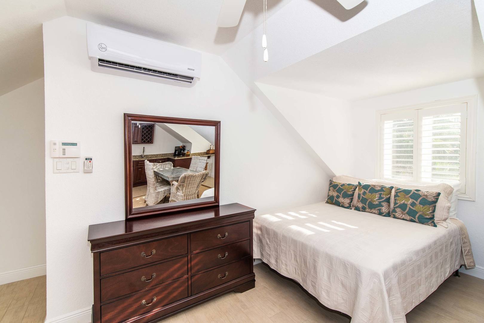 The Guest Suite is furnished with a queen bed and air conditioning.