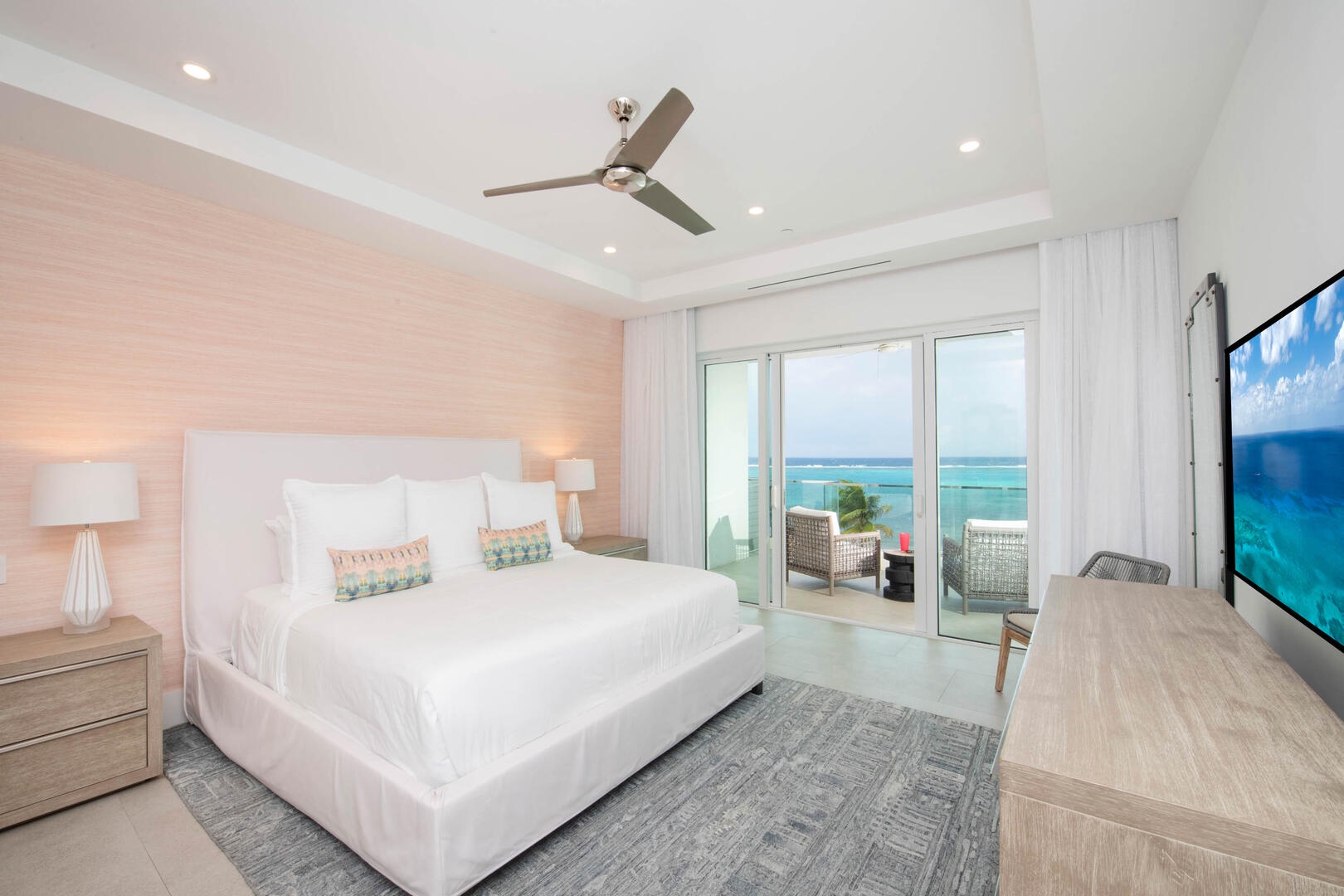 Primary Suite with king bed, SmartTV, and walk-out access to the balcony.