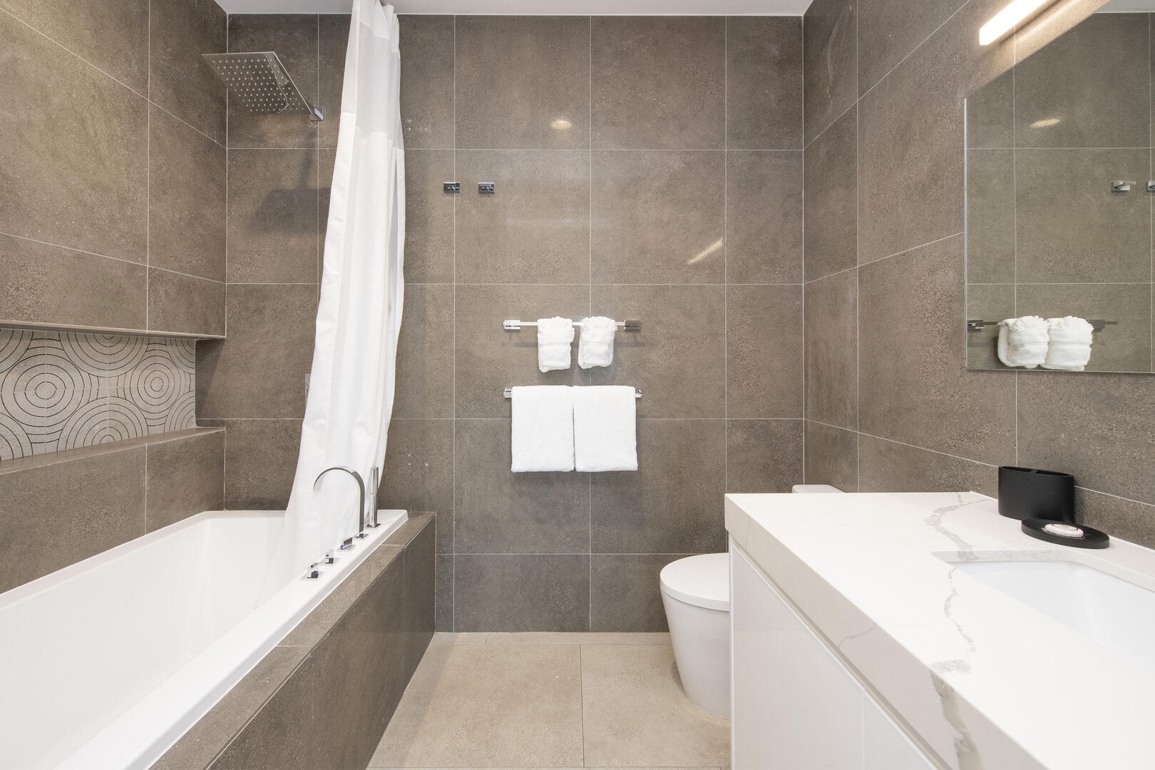 Guest ensuite #1 with shower bath.