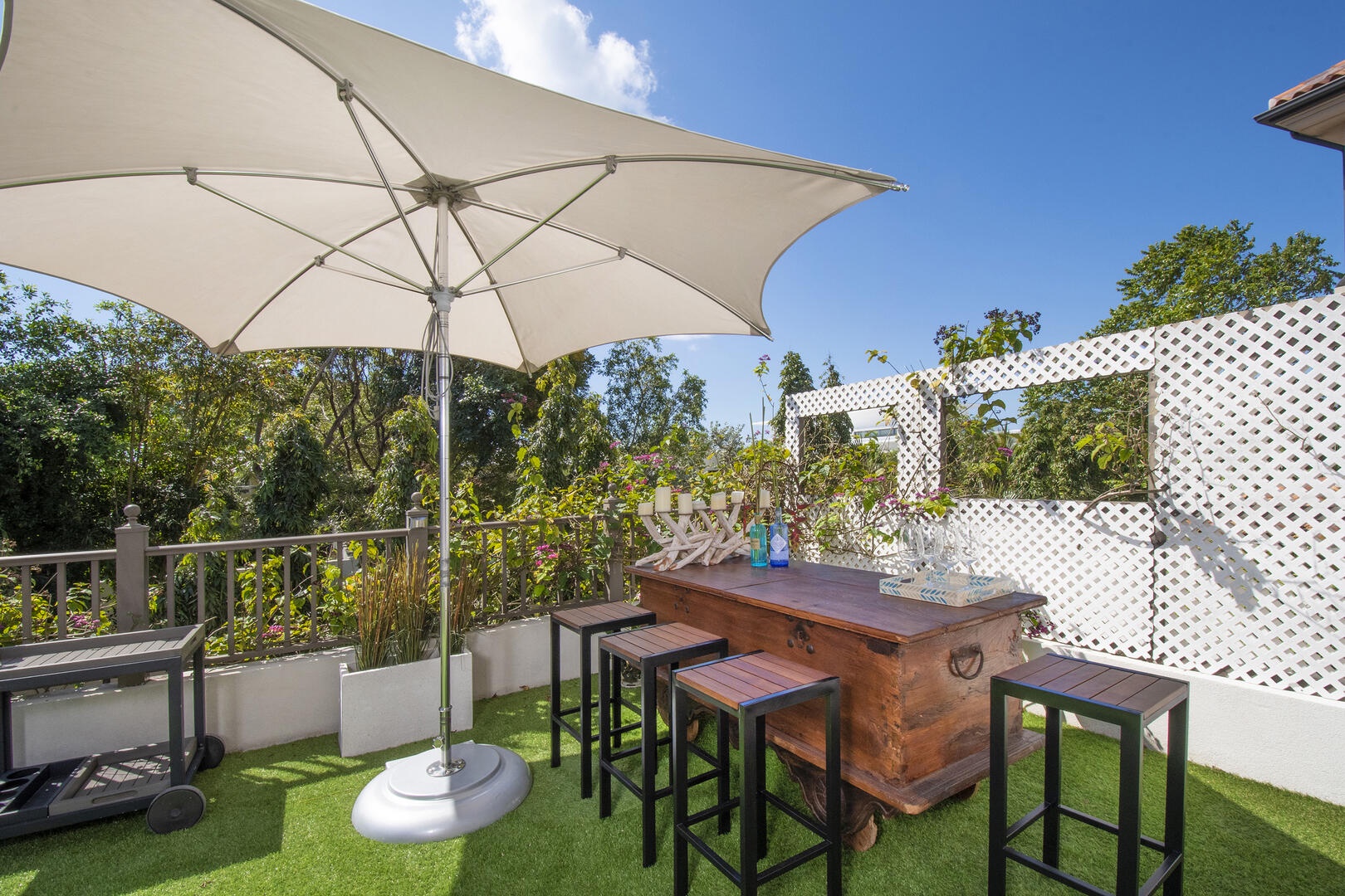 Bar cart and a shade umbrella ready for happy hour!