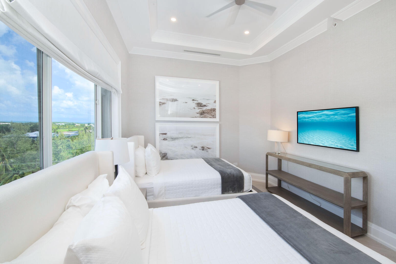 Guest suite #2 with two full beds and television.