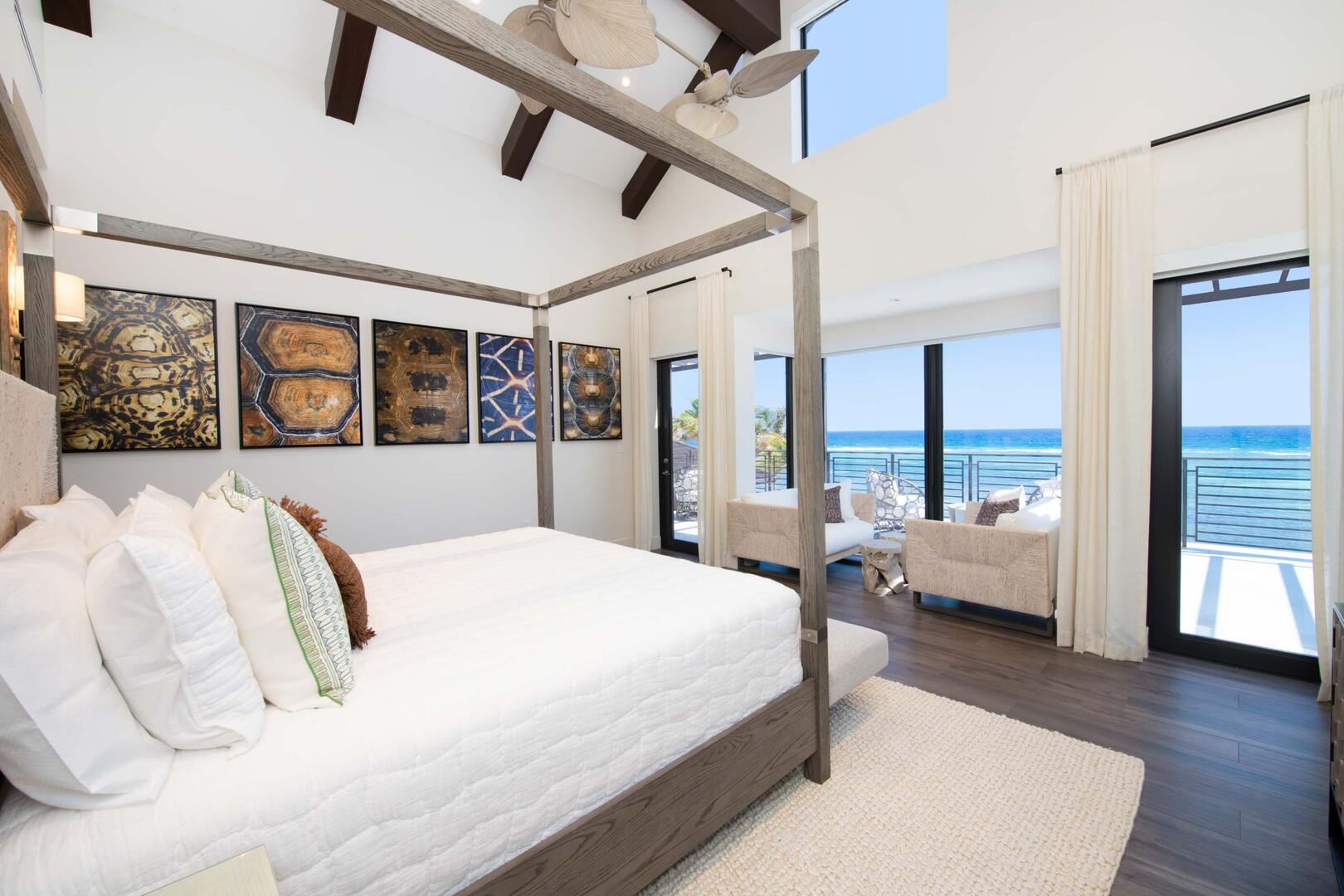 Primary Suite ? upper-level, king bed, oceanfront, vaulted ceilings, walk-out access to oceanfront railed balcony, cable connected Smart TV in hidden console, walk-in closet.