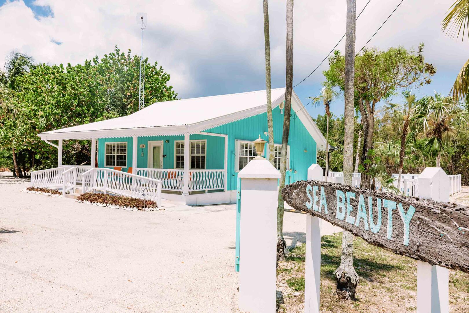 Sea Beauty gated driveway is marked with signage welcoming guests home.