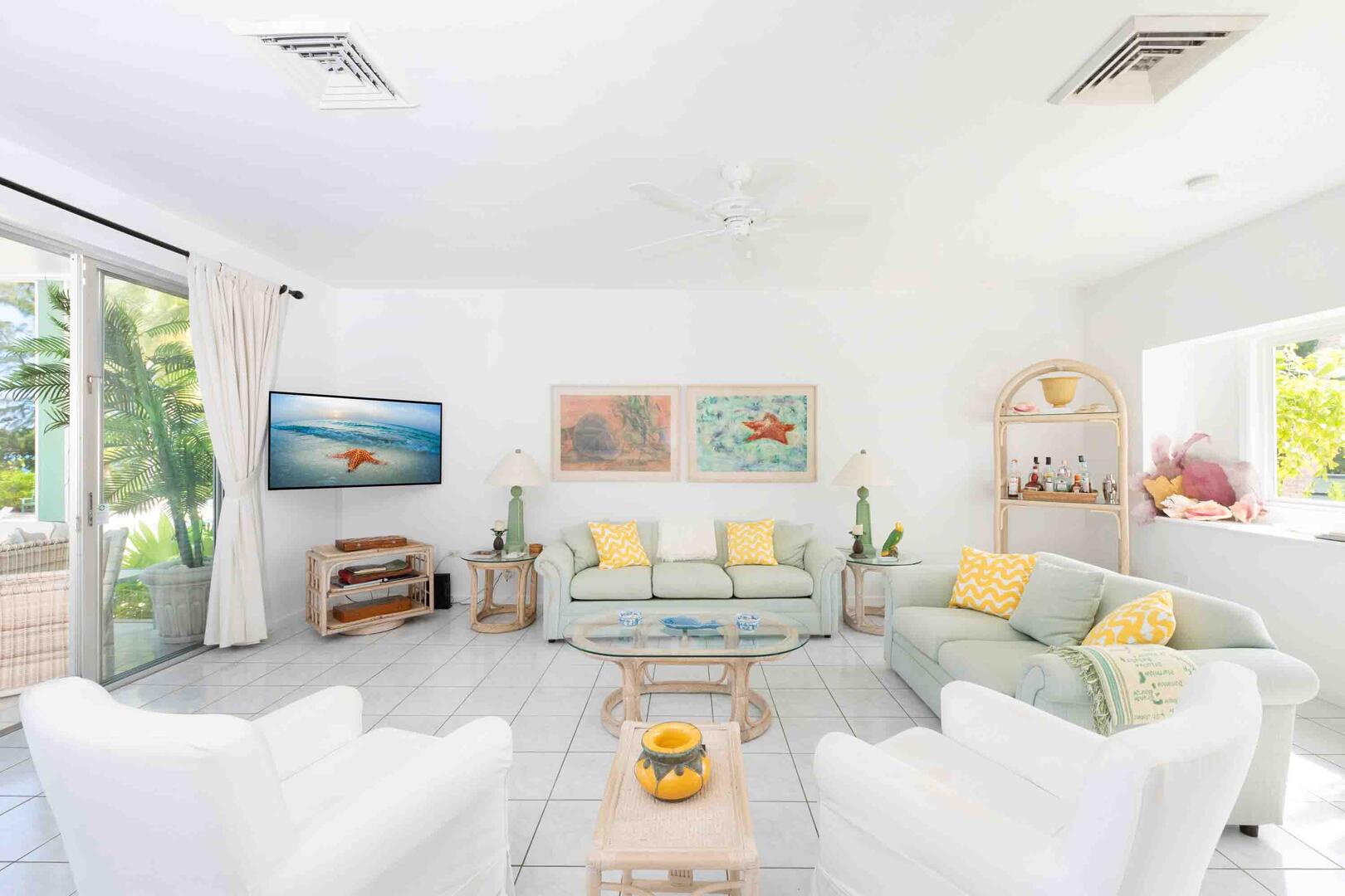 Living area with sofa seating and an HD television.