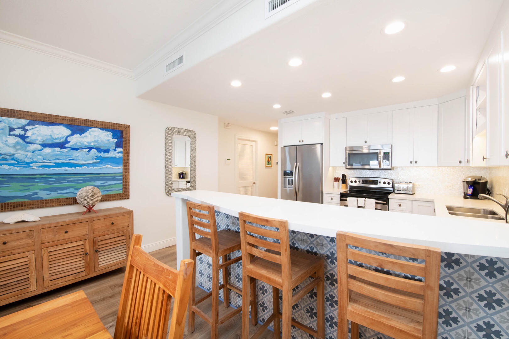 Kitchen with breakfast bar seating for 3 guests.