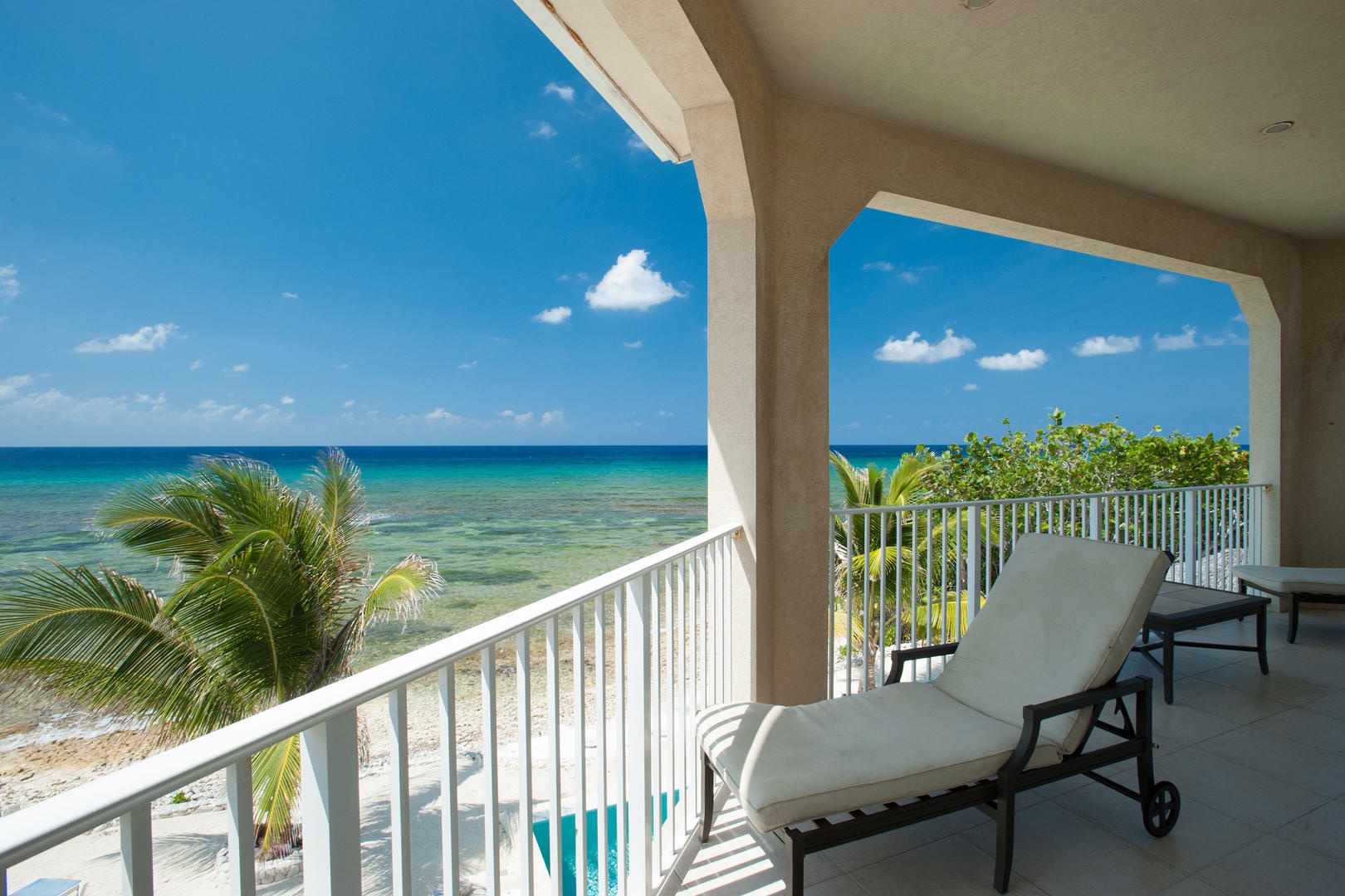 Lounge with the Cayman breeze and beautiful views on the balcony.