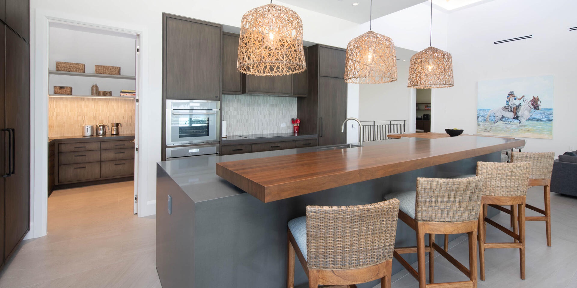 Gourmet kitchen with top-of-the-line appliances and island seating for 4.