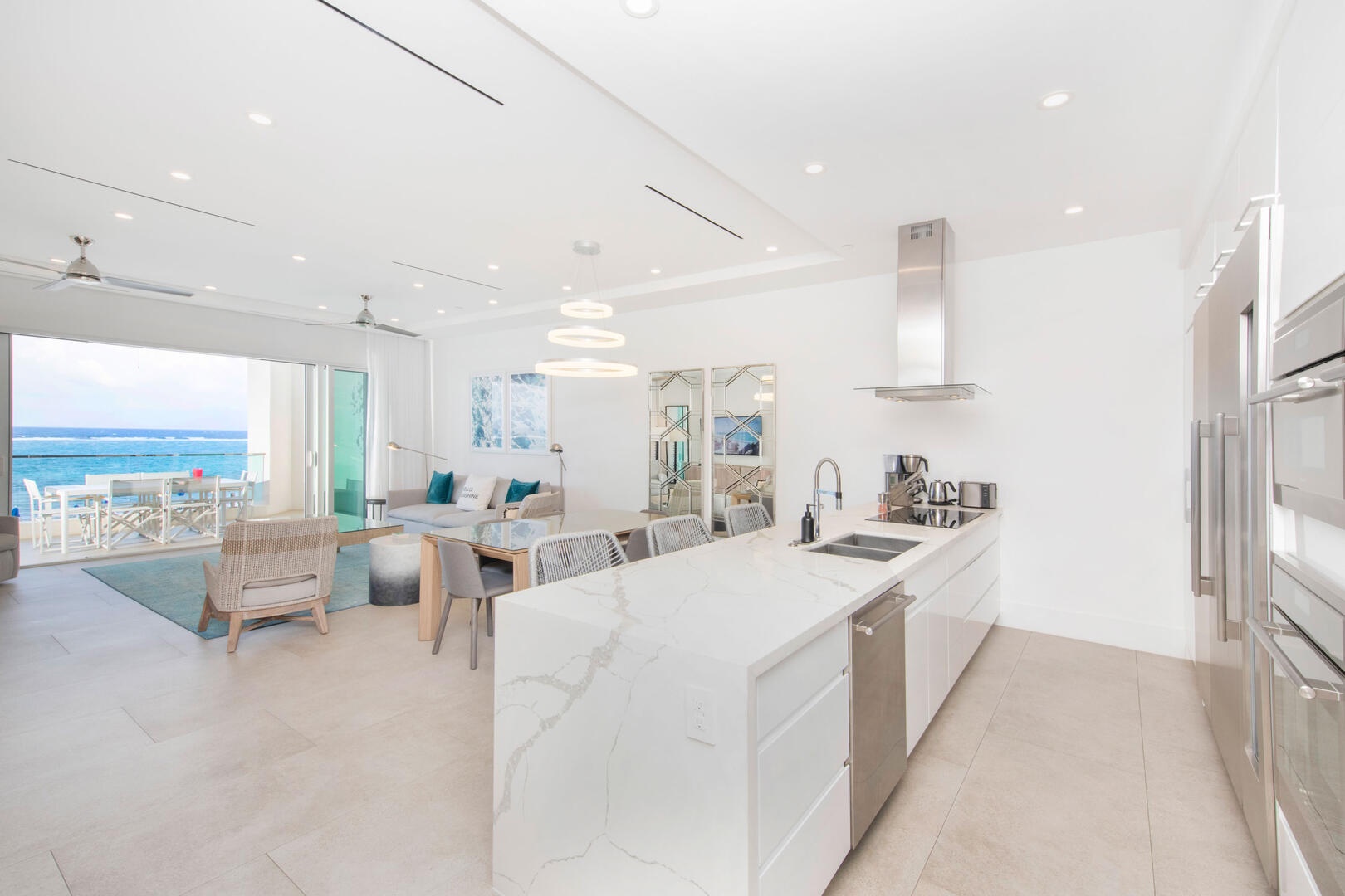 Open concept great room encompassing the living, dining, and kitchen areas.