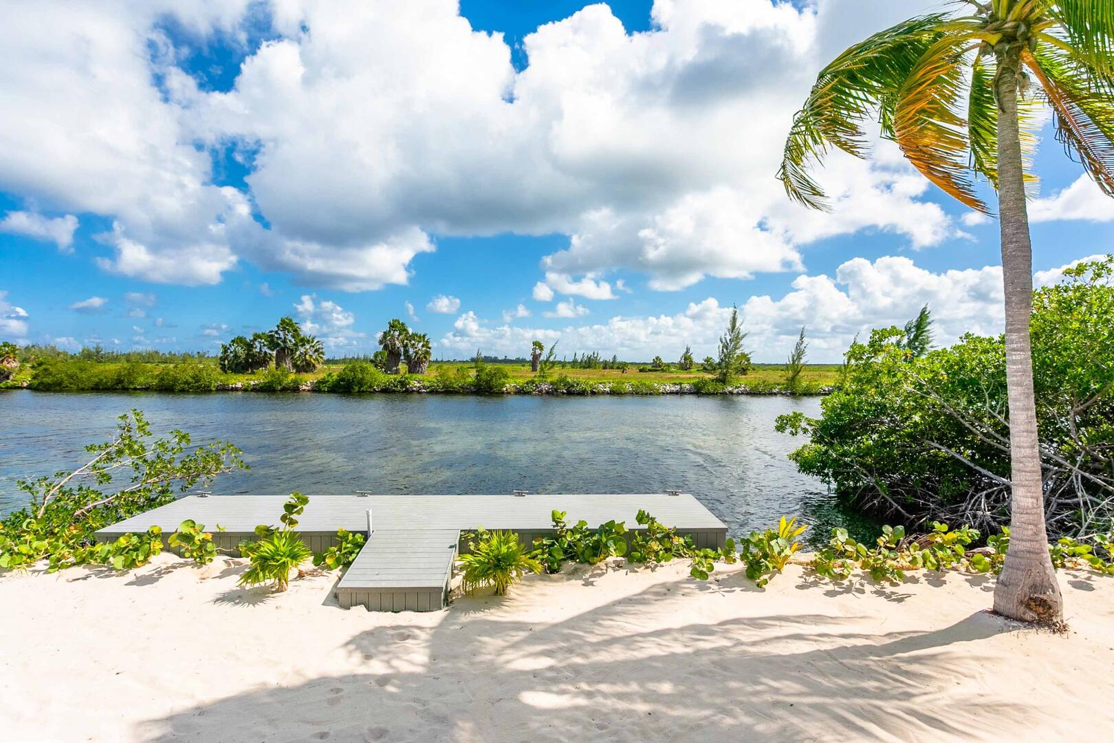 Private dock along the canal behind the villa. Perfect for launching kayaks, jet skis, or charter dock service.