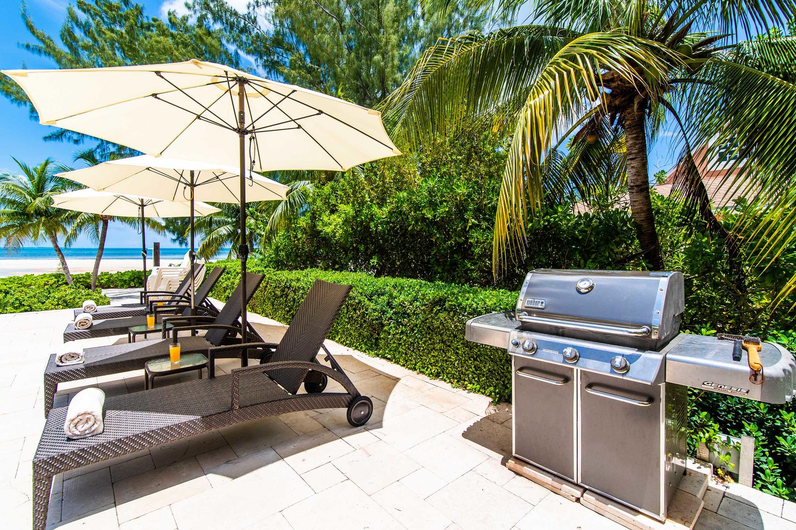 Propane grill on the pool deck for island cookouts.