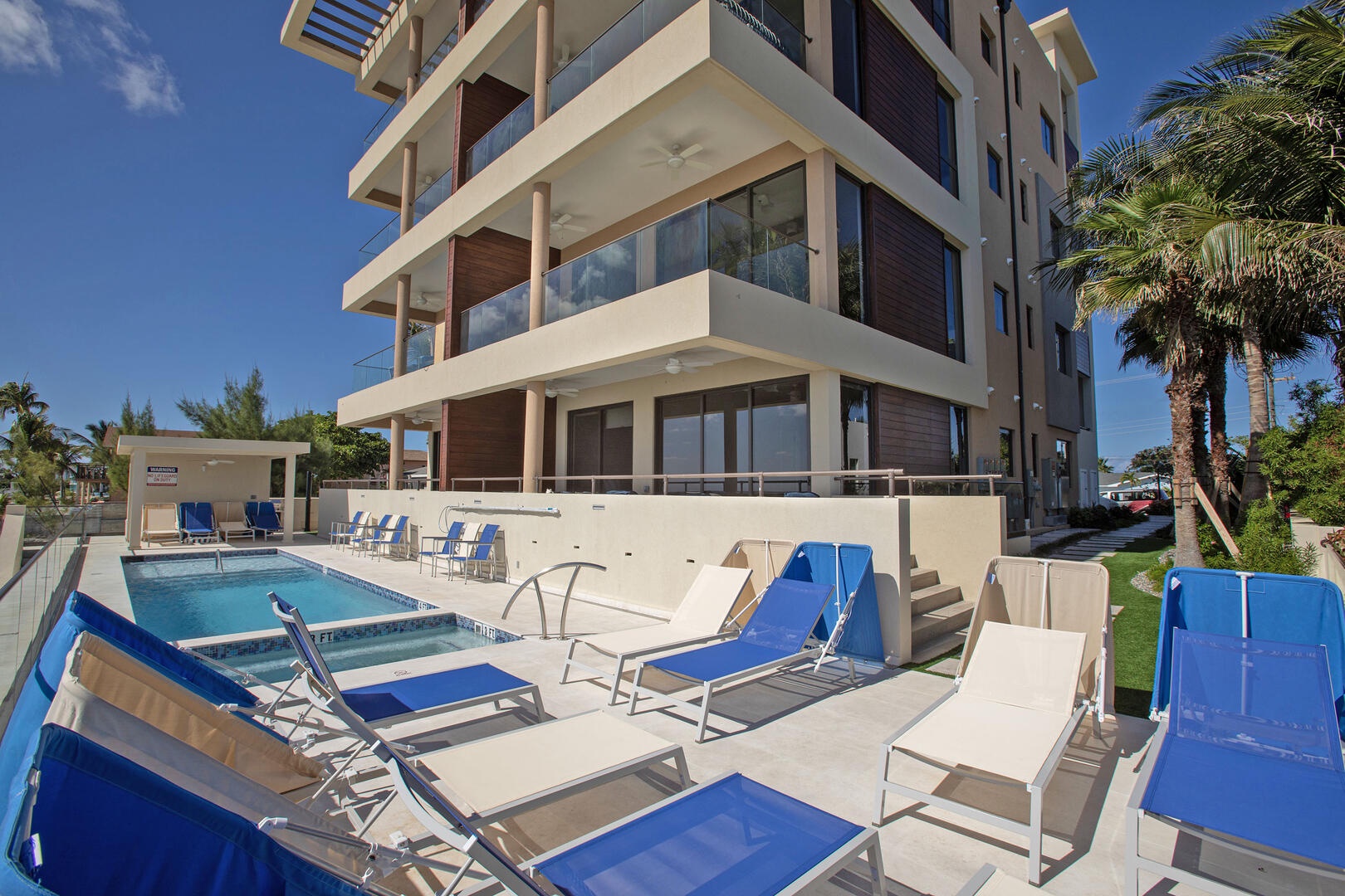 Walk-out access to the pool deck just steps off condo's balcony.