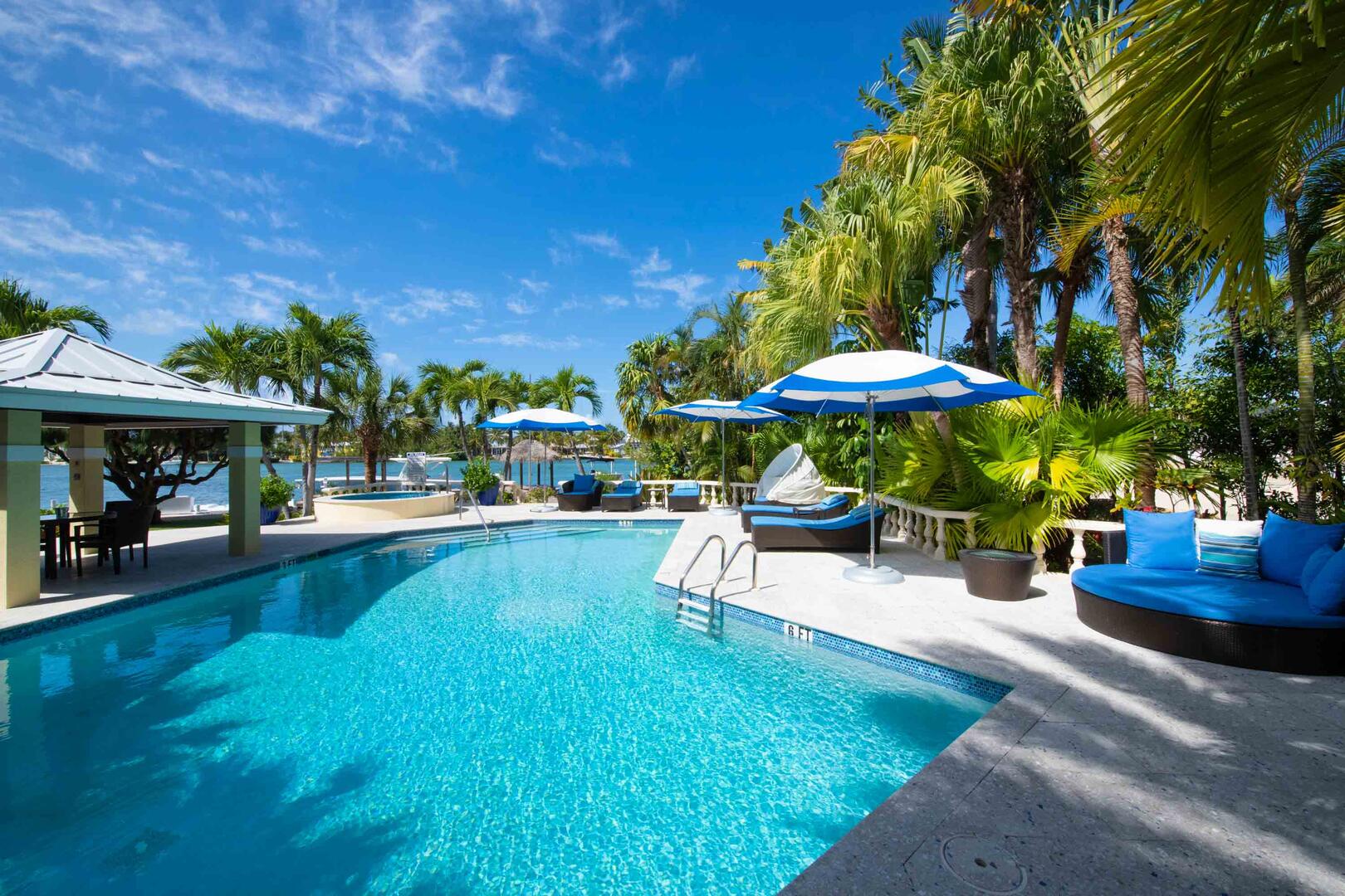 Pool deck with forever blue water views.
