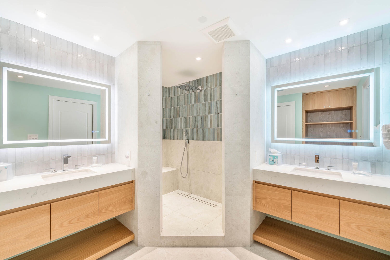 Fully renovated primary ensuite with dual vanity plus rainfall shower.