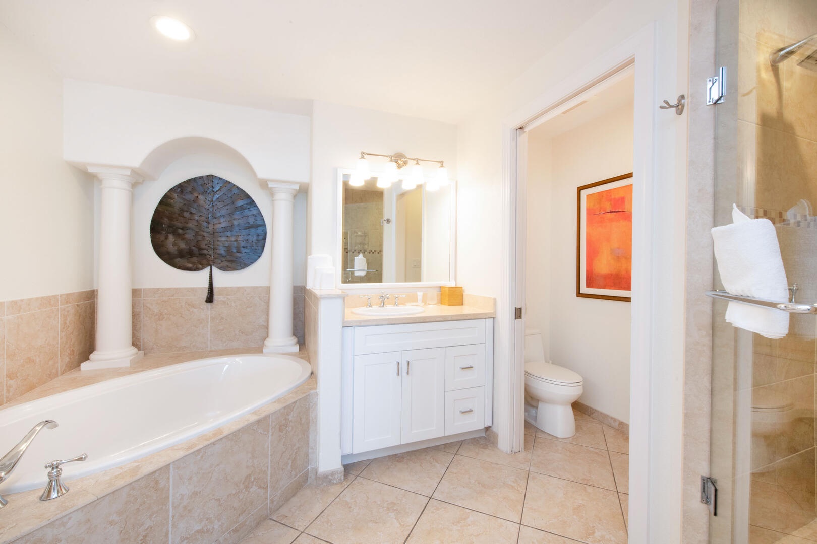 Primary ensuite bath with double vanity, soaking tub, walk-in shower.