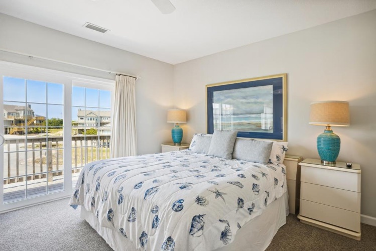 Drift off in your tranquil bedroom, where soft coastal blues meet natural light. The private balcony frames peaceful views, and stylish touches create your perfect retreat.