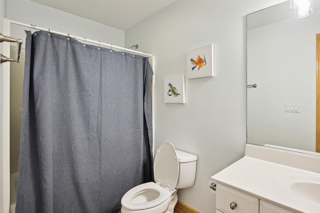 Freshen up in your bright, modern bathroom with a spacious shower and cheerful artwork that adds a splash of color to your stay.