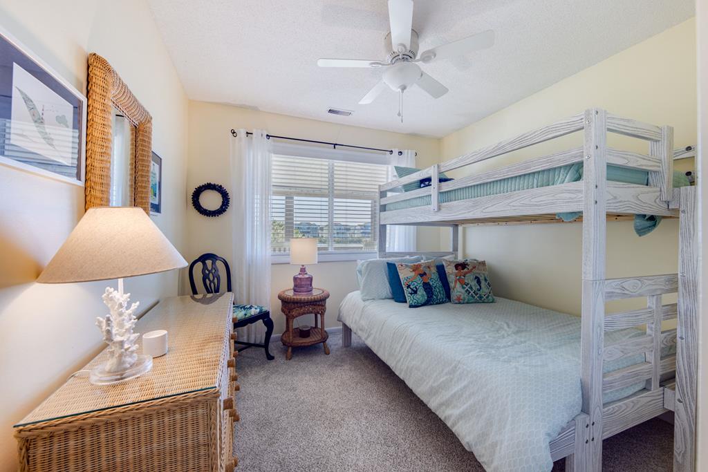 Your coastal retreat with whitewashed bunk beds, beachy décor, and soft natural light—perfect for family stays and seaside memories.