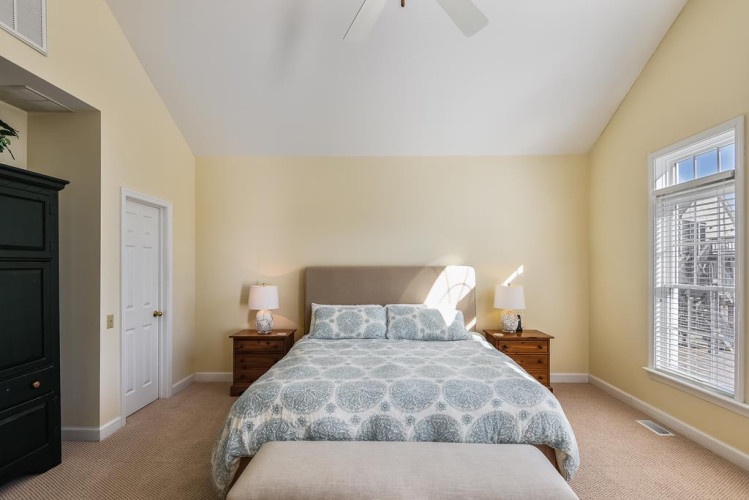 Sink into your peaceful retreat, where soft light pours through tall windows and vaulted ceilings create an airy, spacious sanctuary for restful nights.