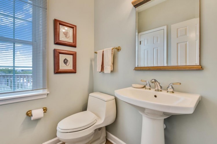 Refresh in your private bathroom with classic fixtures, soft natural light, and elegant brass details throughout.
