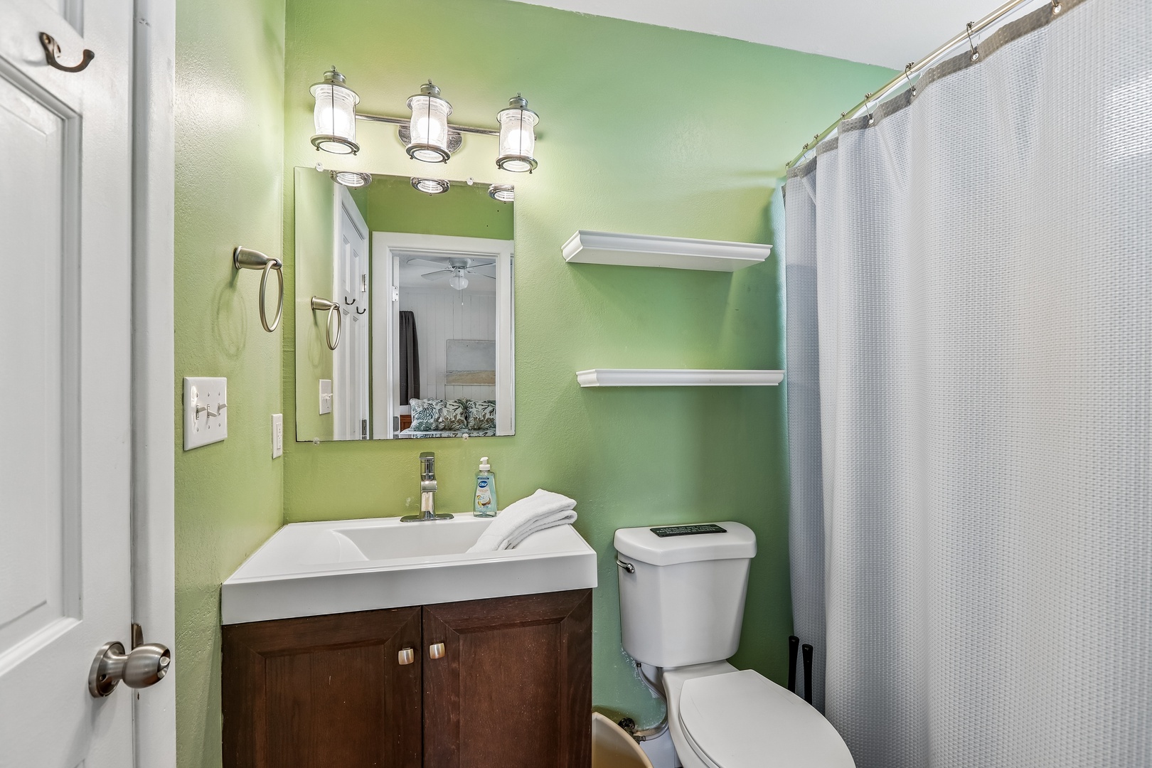 Freshen up in your bright, cheerfully appointed bathroom with modern fixtures and soothing green walls that set a relaxing tone for your stay.