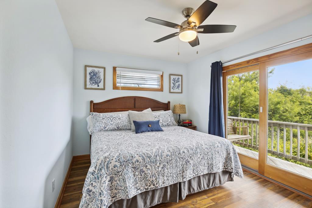 Sink into crisp linens and wake to treetop views beyond your private balcony—your serene coastal escape awaits.