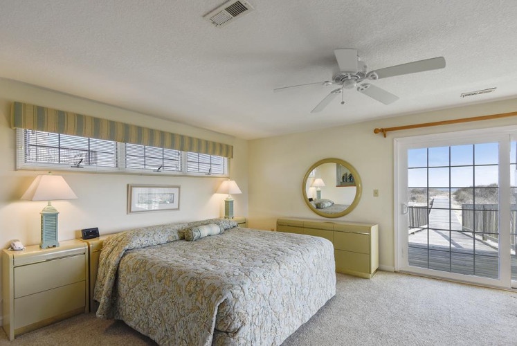 Wake up to natural light and step straight onto your private balcony from this airy bedroom. Soft colors and comfortable furnishings create a peaceful retreat where you'll unwind after each day's adventures.