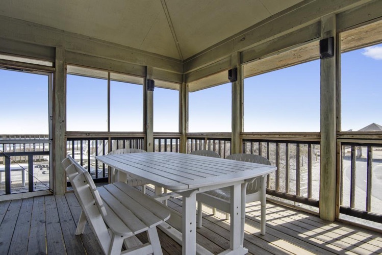 Gather around this beachside table on your screened porch and soak in endless coastal views while staying protected from the elements.