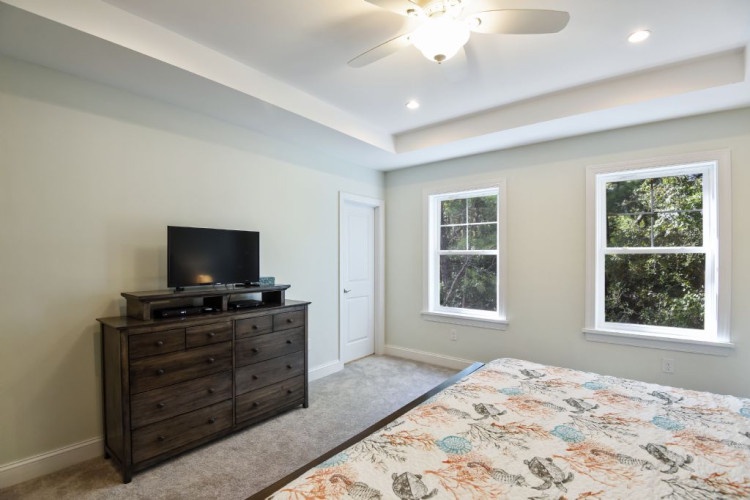 Sink into your cozy retreat with plush carpeting, refreshing natural light, and a ceiling fan overhead to keep your space perfectly comfortable.