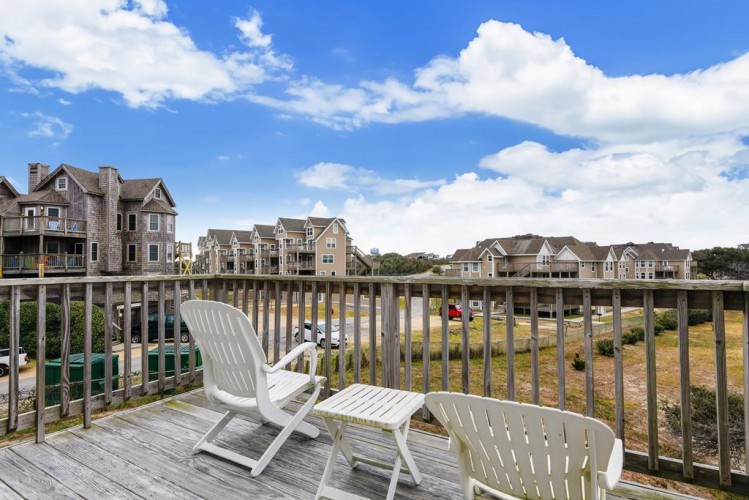 Relax on your private deck with peaceful views of the surrounding neighborhood and coastal homes. The perfect spot to enjoy your morning coffee while soaking in the local charm.