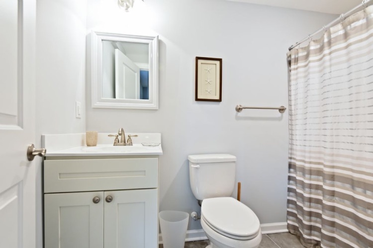 A bright, clean bathroom awaits you with fresh linens and all the essentials for your stay, thoughtfully arranged for your comfort and convenience.