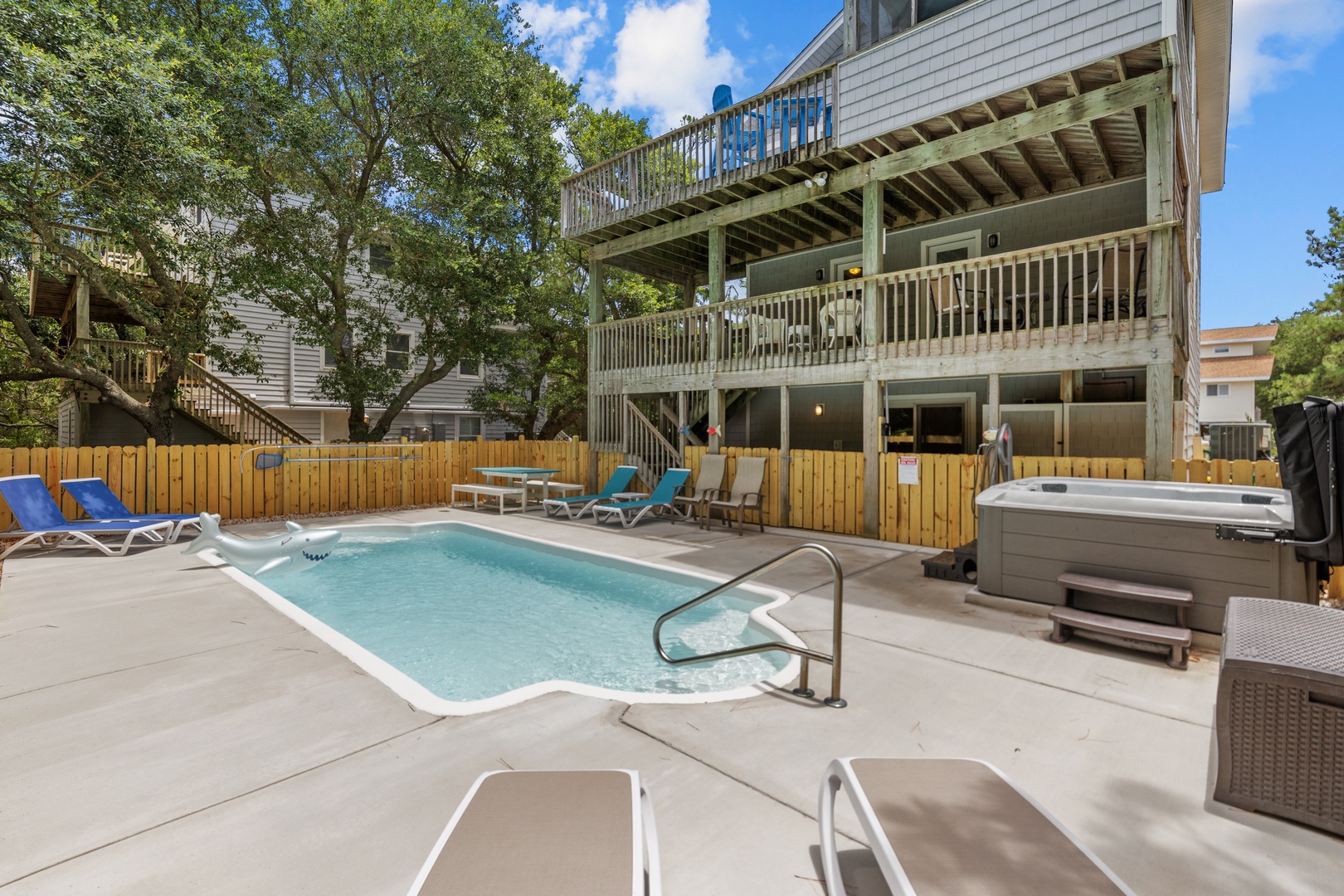 Your private oasis awaits with a sparkling pool, bubbling hot tub, and sunbeds—perfect for soaking up the sun or unwinding under the stars after a day of adventure.