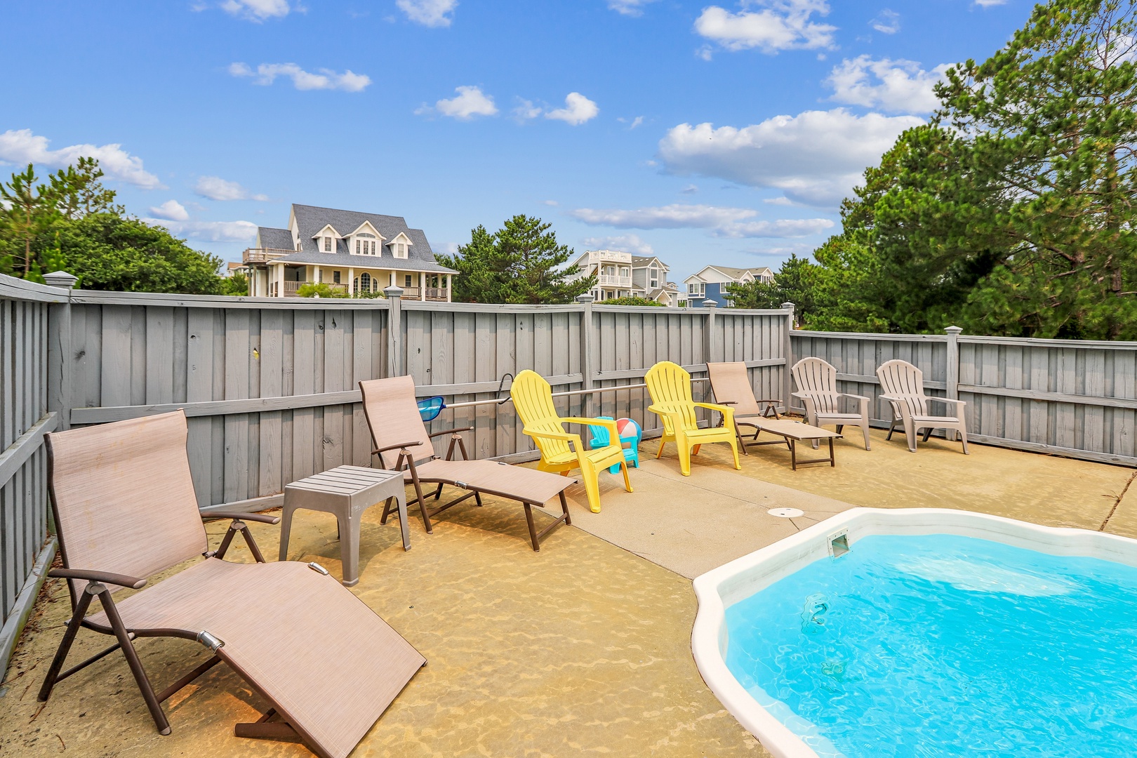 Soak up the sunshine on your private patio, complete with a refreshing splash pool and plenty of loungers for lazy afternoons under blue skies.