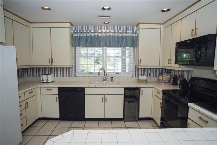 Cook your favorite meals in this spacious, well-equipped kitchen, complete with modern appliances, plenty of counter space, and everything you need to feel right at home.
