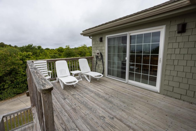 Step onto your private deck where two lounge chairs await, perfectly positioned to soak in the lush forest views and feel the coastal breeze surround you.
