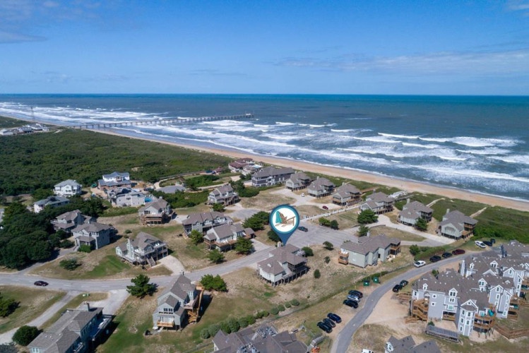 This coastal property sits within a quiet beach neighborhood, offering direct proximity to the Atlantic shore and its rolling waves.