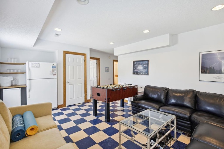 Your own game room awaits! Challenge friends to foosball, kick back on comfy leather seating, and enjoy the playful checkered floor that sets a fun, relaxed vibe.