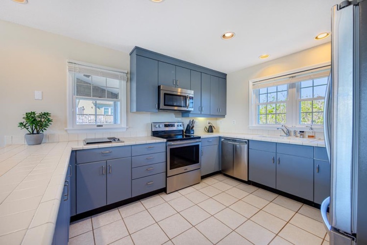 Your fully equipped kitchen features modern appliances, plenty of counter space, and natural light—perfect for preparing meals during your stay.