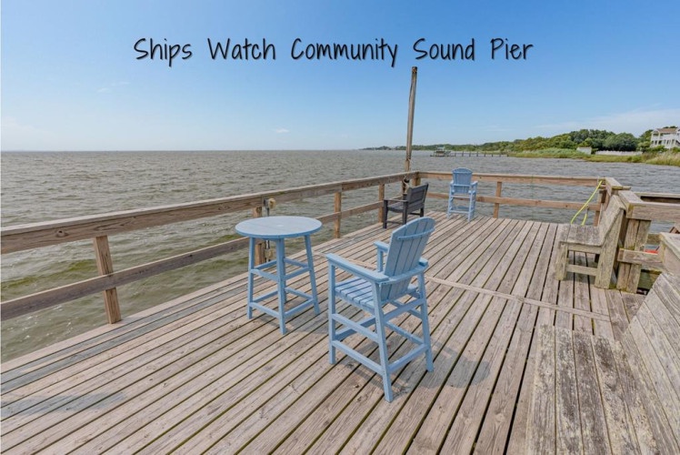 This waterfront community pier provides direct access to tranquil waters and coastal scenery, offering a peaceful spot to observe passing vessels and enjoy the surrounding natural landscape.