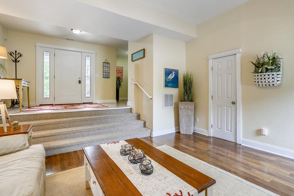 Unwind in your welcoming living space, where warm tones, coastal touches, and open flow create the perfect retreat after exploring nearby attractions.