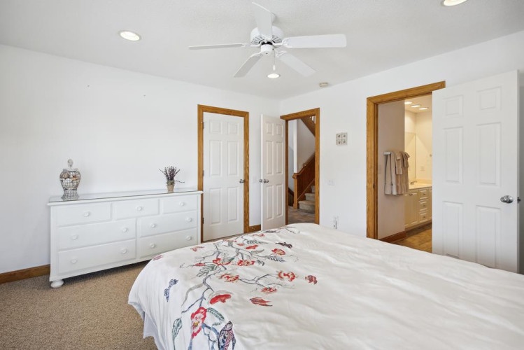 Your bright, peaceful bedroom offers cool ceiling fan breezes, soft carpeting underfoot, and an ensuite bathroom just steps away for your convenience.