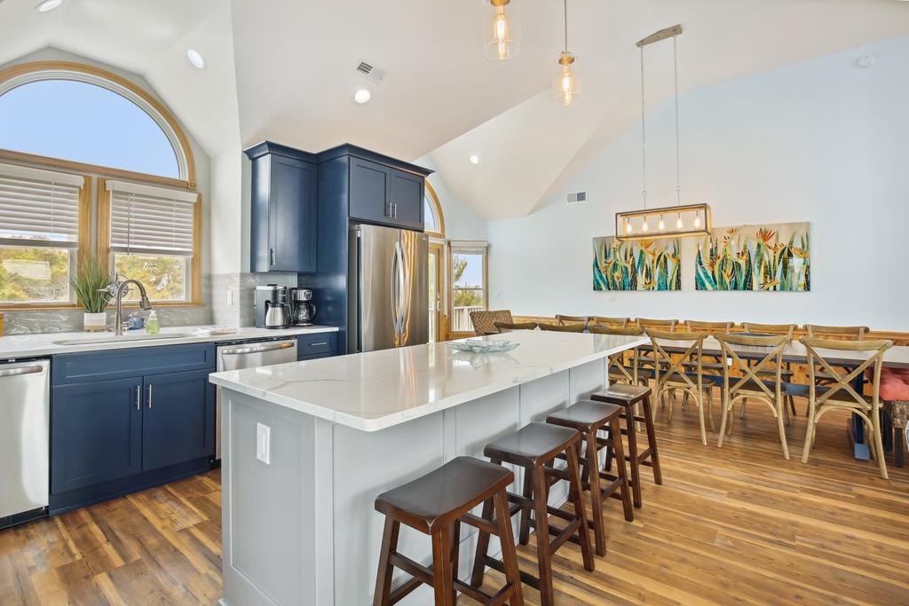 Gather around your bright kitchen island with modern appliances, vaulted ceilings, and a spacious dining area—perfect for memorable meals with loved ones.
