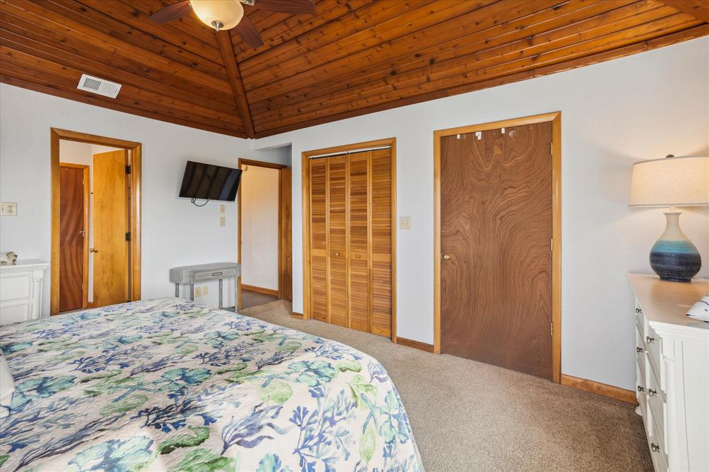 Relax under beautiful vaulted wood ceilings in your cozy bedroom. Enjoy your own TV, ample closet space, and warm lighting that makes you feel right at home.
