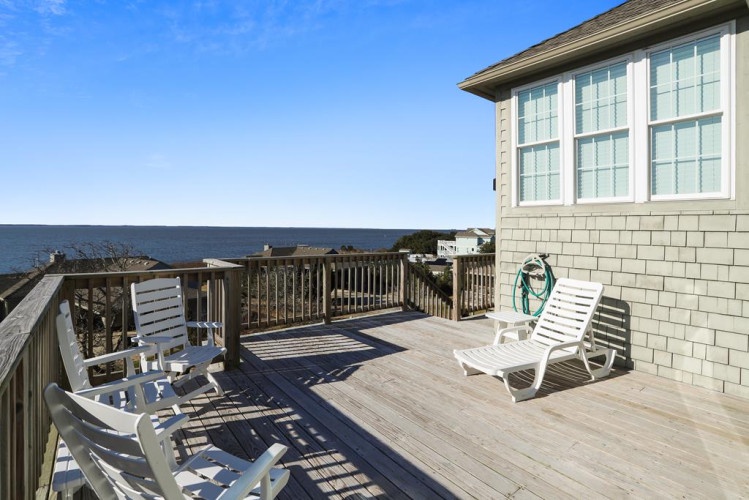 This sunny deck offers sweeping ocean views and comfortable lounge chairs for your morning coffee or evening relaxation by the sea.