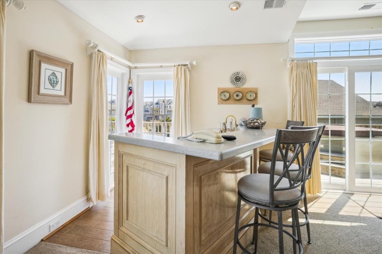 Settle in at your private breakfast bar with morning coffee and neighborhood views streaming through bright windows. The perfect spot to plan your day's adventure or simply savor a quiet moment.