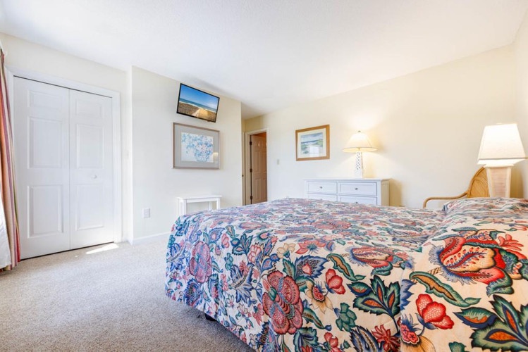 Sink into your cozy bedroom where cheerful linens and soft lighting create a peaceful retreat after a day of adventure.