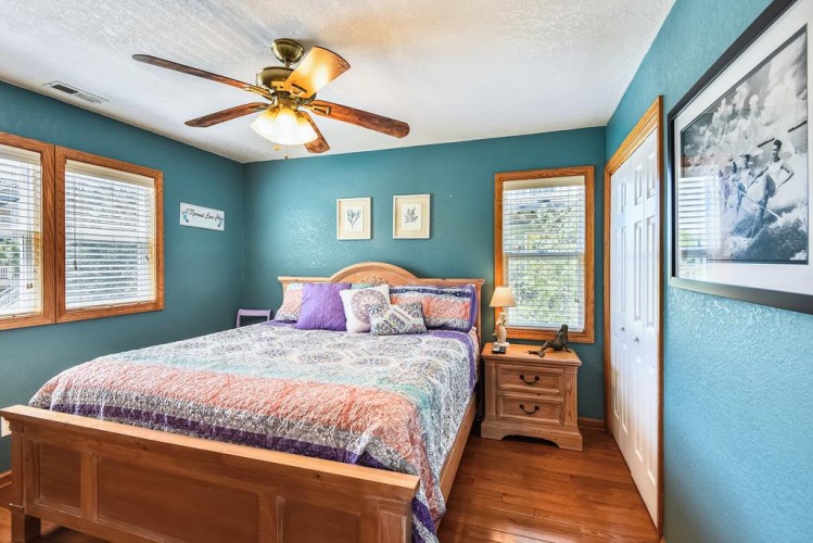 Slip into crisp linens and drift off under the soft glow of warm lighting. The calming teal tones and hardwood floors create your peaceful retreat after a day of adventure.